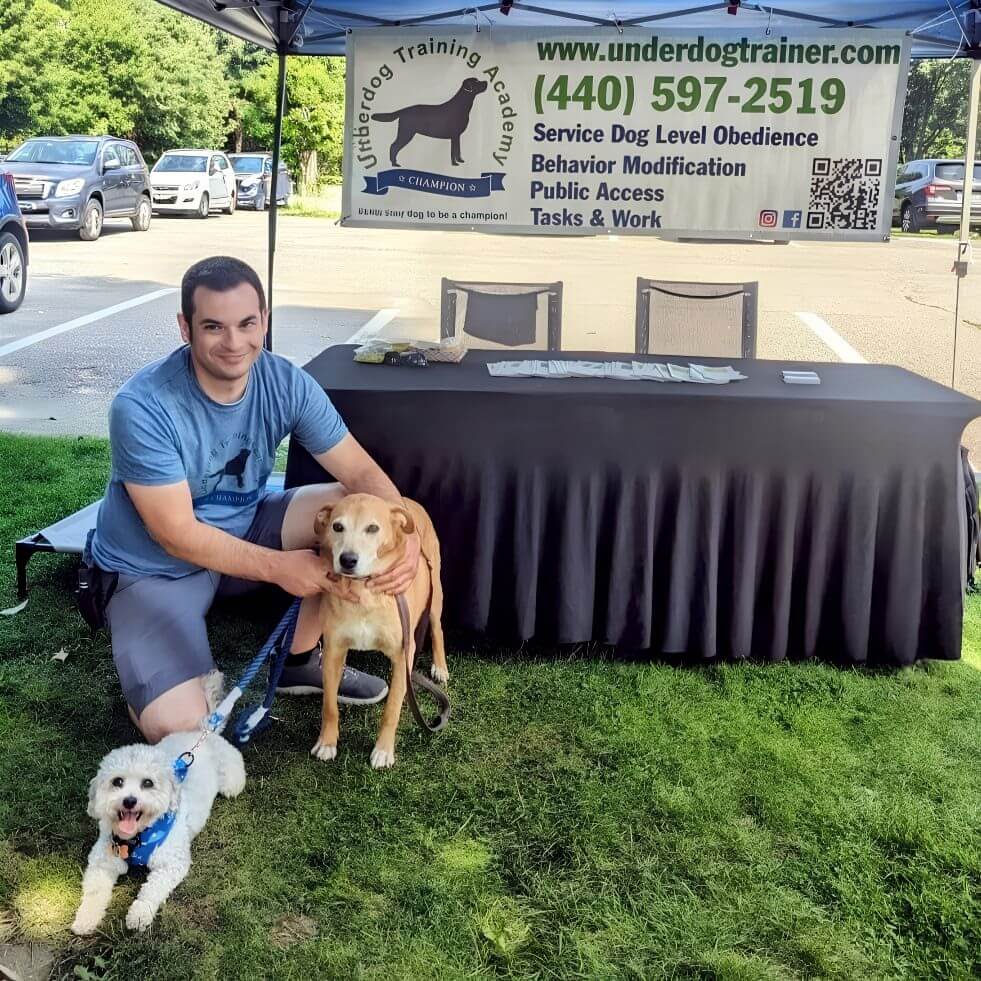 Josh With Dogs at Underdog Training Academy Josh from Underdog Training Academy with two dogs at a dog training event in Cleveland, Ohio