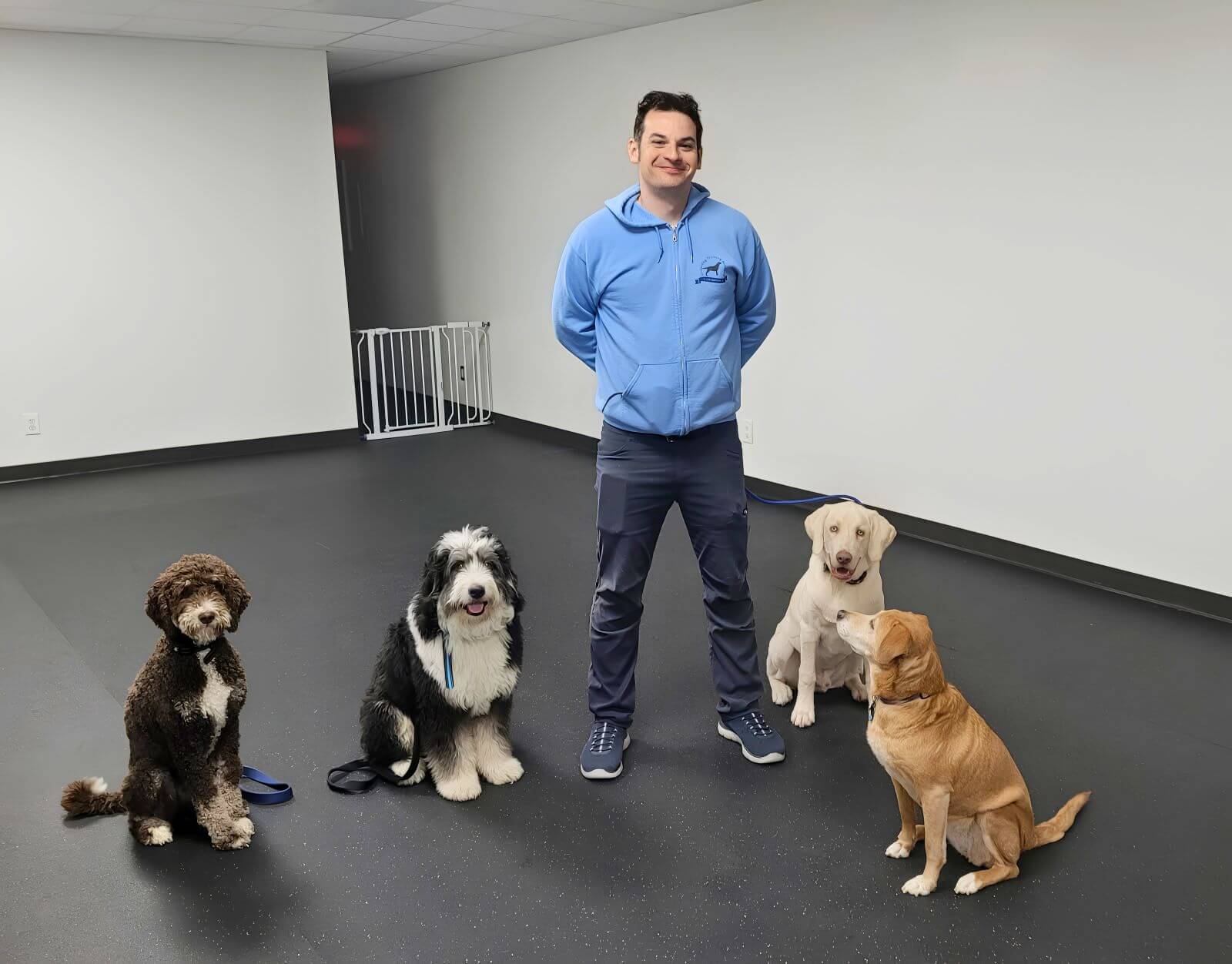Josh Training Dogs at Underdog Training Academy Josh from Underdog Training Academy standing with dogs during obedience training in Cleveland Ohio